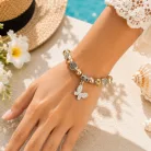 Életfa és Pillangó Charm Karkötő – Aranybézs Elegancia